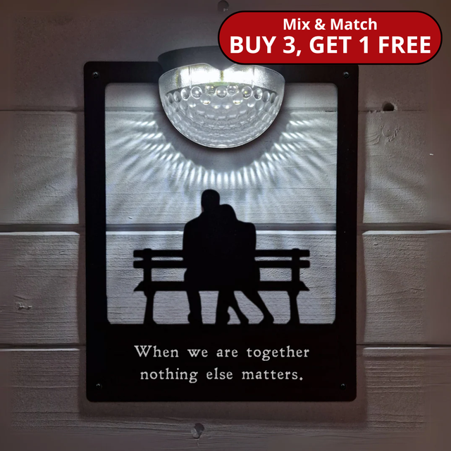 'When we are together nothing else matters' Couple on Bench Solar Light Wall Plaque