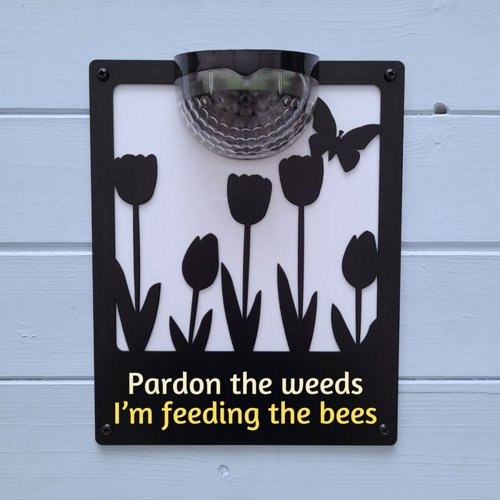 'Pardon the weeds, I'm feeding the bees' Tulips Solar Light Wall Plaque