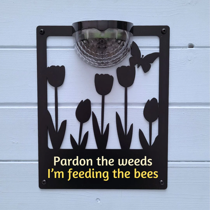 'Pardon the weeds, I'm feeding the bees' Tulips Solar Light Wall Plaque