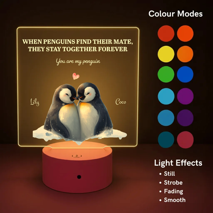 LED night light with penguin design and color mode options on a dark background